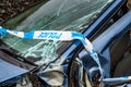 Total loss car with broken windscreen, axle fracture and police barrier band Royalty Free Stock Photo