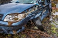 Total loss car with broken windscreen, axle fracture and police barrier band Royalty Free Stock Photo