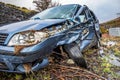 Total loss car with broken windscreen, axle fracture and police barrier band Royalty Free Stock Photo