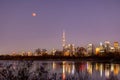 Total lunar eclipse full moon over the Toronto skyline and CN Tower