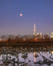 Total lunar eclipse full moon over the Toronto skyline and CN Tower