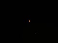 Total lunar eclipse night sky in July 2018 red blood moon with planet mars seen from Baden-Wuerttemberg Germany Royalty Free Stock Photo