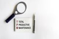Total productive maintenance TPM is shown using a text Royalty Free Stock Photo