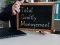 Total Quality Management TQM is shown on the conceptual business photo