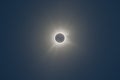 Total solar eclipse of April 8th 2024. Totality with bright corona visible against dark blue