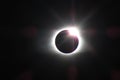 Total solar eclipse diamond ring with rainbow rays in horizontal orientation Royalty Free Stock Photo