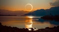 Total solar eclipse event over a lake with reflection.