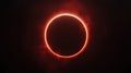 A total solar eclipse with a red glow around the moon. Royalty Free Stock Photo