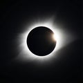Total Solar Eclipse with Diamond Ring Effect in Black Sky Royalty Free Stock Photo