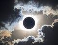 Total Solar Eclipse with Suns Corona Visible Through Dramatic Clouds Royalty Free Stock Photo