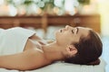 In a total state of bliss. an attractive young woman getting pampered at a beauty spa. Royalty Free Stock Photo