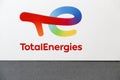 TotalEnergies logo on a wall