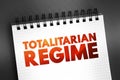 Totalitarian Regime - form of government and political system that prohibits all opposition parties, text concept on notepad