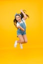 Totally happy. Energy inside. Feeling free. Summer holidays. Jump of happiness. Small girl jump yellow background. Enjoy