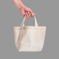 Tote bag canvas white cotton fabric cloth for eco shoulder shopping sack mockup blank template isolated on grey background Royalty Free Stock Photo