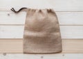 Tote bag with drawstring mockup of small eco sack made from jute hessian canvas or natural hemp burlap flat lay on white