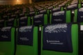 Tote bags repeating elements in a lecture hall of Maastricht University with welcomes packages for exchange students on the chairs