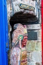 Totem figure in front of a close in Edinburgh