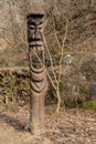 Totem with large open mouth