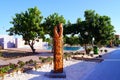 Totem statue and swimming pool