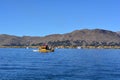 A Totora boat floating on the Titicaca lake, in Peru