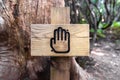 Touch and feel wooden sign in the forest