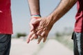 The touch of the hand shows the love, trust and confidence. Rainbow flag is a symbol of lesbian, gay, bisexual, and transgender Royalty Free Stock Photo