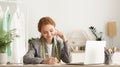 In touch with suppliers. Female tailor talking on phone Royalty Free Stock Photo