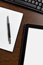 Touch tablet and blank paper Royalty Free Stock Photo