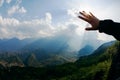 Touch to the sun. Hand touching the sky with ray. Royalty Free Stock Photo