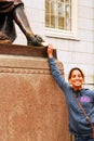 Touching the foot at the Statue of Three Lies