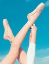 Touching the sky. Pointe shoes worn by ballet dancer. Ballet slippers. Ballerina shoes. Ballerina legs in ballet shoes Royalty Free Stock Photo