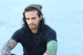 Tough looking hispanic man with long hair and tattoos Royalty Free Stock Photo