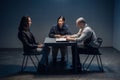 A tough police detective interrogates a crime suspect with a tattooed face in an interrogation room. Royalty Free Stock Photo