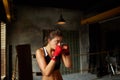 Tough Young Woman Training in Boxing Ring Royalty Free Stock Photo