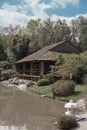 TOULOUSE, FRANCE - Apr 19, 2015: Japanese house on lake with reflections in Japanese garden in To