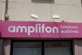 Amplifon sign text and brand logo front of medical shop hearing aid store office