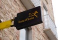 Interflora logo brand and sign text on panel street of florist shop and flowers store