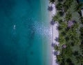 A tour boat drives to an island in Port Barton Palawan Philippines