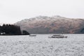 Tour boat on Loch Lomond near Tarbet, Scotland, in spring.