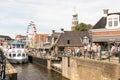 Tour boat by the old lock in Lemmer in Friesland in the north of Netherlands.