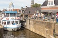 Tour boat by the old lock in Lemmer in Friesland in the north of Netherlands.