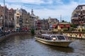 Tour boat in Rokin Canal in Amsterdam