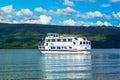 Tour boat on a sunny day at Loch Lomond lake in Luss, Scotland, 21 July, 2016 Royalty Free Stock Photo