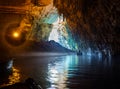 Tour by boat tourists in a cave with an underground lake Melissani on the island of Kefalonia, Greece Royalty Free Stock Photo