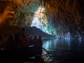 Tour by boat tourists in a cave with an underground lake Melissani on the island of Kefalonia, Greece