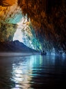 Tour by boat tourists in a cave with an underground lake Melissani on the island of Kefalonia, Greece