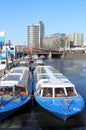 Tour boats in frozen canal, Amsterdam