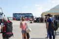 Tour buses and tourists at Donsak Pier, Surat Thani, Thailand.