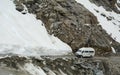 A tour car running on the snow road in Khardungla, India Royalty Free Stock Photo